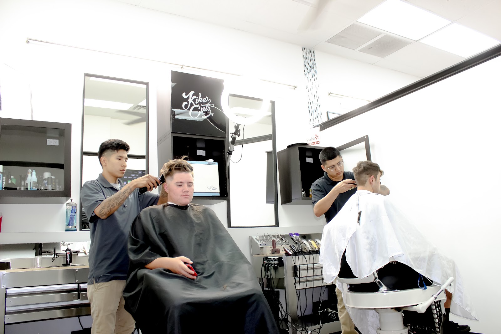 Two of our barbers working side by side in the studio